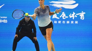 2023-10-13 06:29:36 Ukraine's Anhelina Kalinina hits a return to China's Zheng Qinwen during their women’s singles quarter-final match of the WTA Zhengzhou Open tennis tournament in Zhengzhou, in China's central Henan province on October 13, 2023. 
STR / AFP