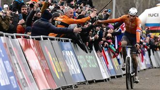 Dutch rider Mathieu van der Poel celebrates with spectators as he arrives to cross the finish line to win the men's elite race of the Cyclocross World Championships in Tabor, Czech Republic on February 4, 2024.  
Michal Cizek / AFP