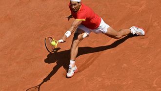 (FILES) Spain's Rafael Nadal returns to Serbia's Novak Djokovic during their men's singles second round tennis match on Court Philippe-Chatrier at the Roland-Garros Stadium at the Paris 2024 Olympic Games, in Paris on July 29, 2024.  Rafael Nadal announced on October 10, 2024 he will retire from professional tennis after the Davis Cup finals in November, ending a career in which he won 22 Grand Slam titles and Olympic singles gold.
Miguel MEDINA / AFP