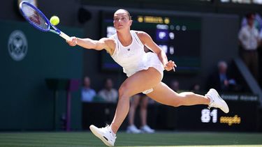 Ukraine's Marta Kostyuk returns to Italy's Jasmine Paolini during their women's singles quarter-final tennis match on the tenth day of the 2026 Wimbledon Championships at The All England Lawn Tennis and Croquet Club in Wimbledon, southwest London, on July 8, 2026. 
HENRY NICHOLLS / AFP