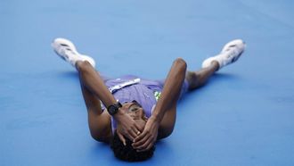epa11686359 Ethiopian athlete Yomif Kejelcha reacts after breaking a new world record with a time of 57 minutes and 30 seconds, during the Valencia's Half Marathon held in Valencia, eastern Spain, 27 October 2024.  EPA/Biel Alino