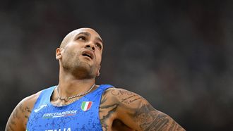 2023-08-19 21:22:56 Italy's Lamont Marcell Jacobs crosses the finish line in the men's 100m heats during the World Athletics Championships at the National Athletics Centre in Budapest on August 19, 2023. 
Jewel SAMAD / AFP