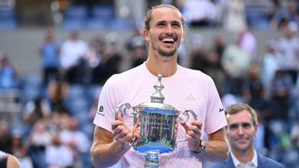 Germany's Alexander Zverev holds the trophy after defeating USA's Ben Shelton in the men's singles final tennis match on day fifteen of the US Open tennis tournament at the USTA Billie Jean King National Tennis Center in New York on September 13, 2026. 
ANGELA WEISS / AFP